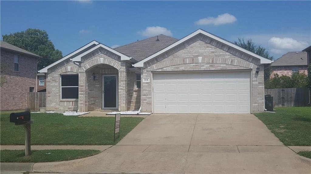 a front view of a house with garage and garage