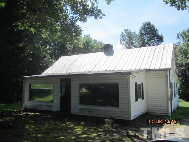 2543 Leasburg Road Roxboro, NC 27574 - Photo 1 of 18 a view of a house with a yard and wooden floor
