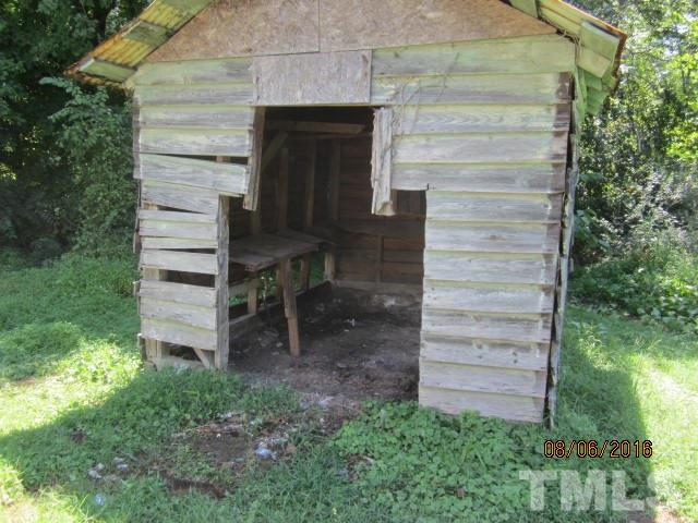 2543 Leasburg Road Roxboro, NC 27574 - Photo 13 of 18 a view of a wooden door of the house