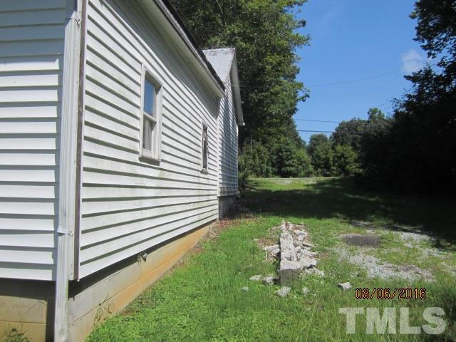2543 Leasburg Road Roxboro, NC 27574 - Photo 15 of 18 a backyard of a house with lots of green space