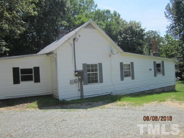 2543 Leasburg Road Roxboro, NC 27574 - Photo 16 of 18 a view of a house with a yard
