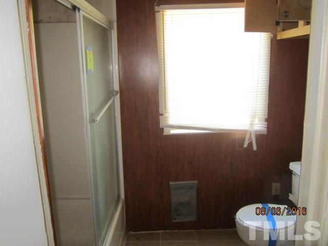 2543 Leasburg Road Roxboro, NC 27574 - Photo 3 of 18 a bathroom with a sink and a toilet