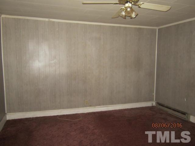 2543 Leasburg Road Roxboro, NC 27574 - Photo 5 of 18 a view of a room with wooden floor