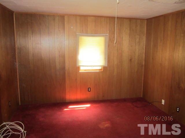 2543 Leasburg Road Roxboro, NC 27574 - Photo 6 of 18 a view of an empty room with a window