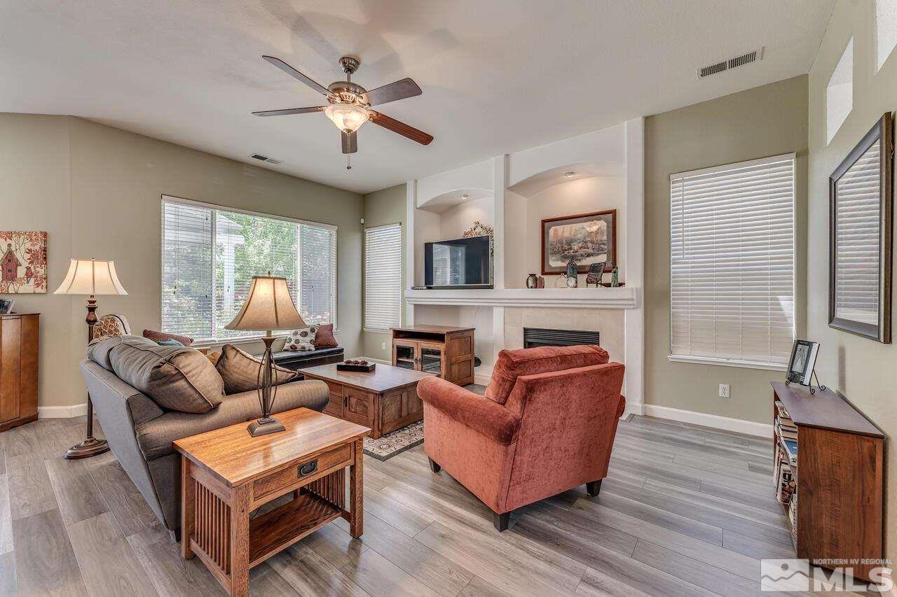 1830 Montelena Court Reno, NV 89521 - Photo 6 of 39 a living room with fireplace furniture and a large window