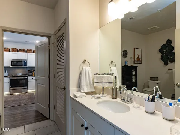 a kitchen with a sink and a refrigerator