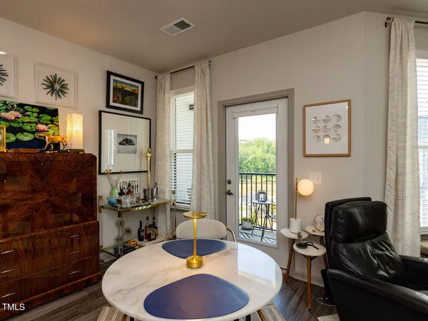 a living room with furniture rug and window
