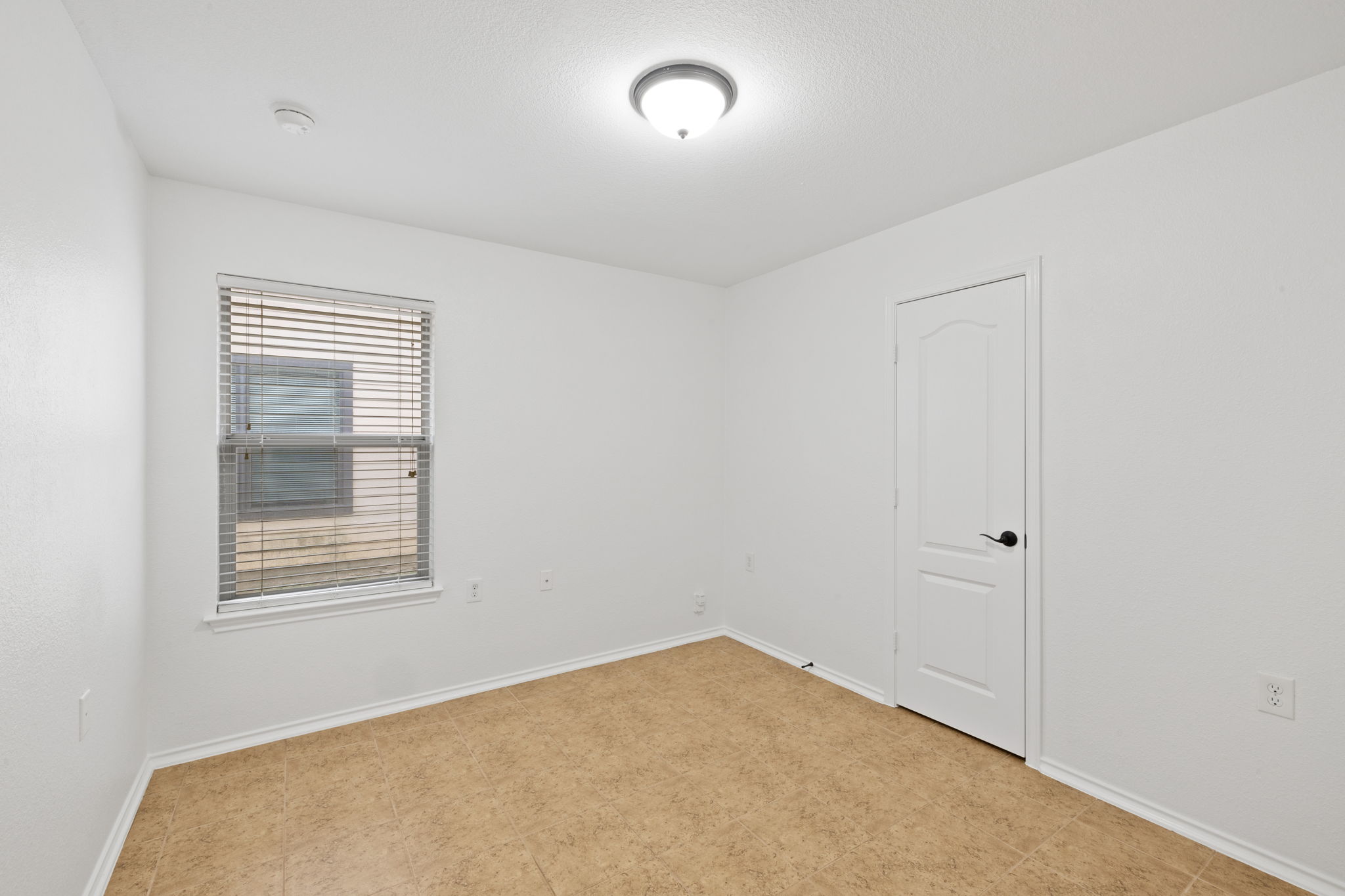 8825 Stambourne Street Austin, TX 78747 - Photo 15 of 37 an empty room with windows