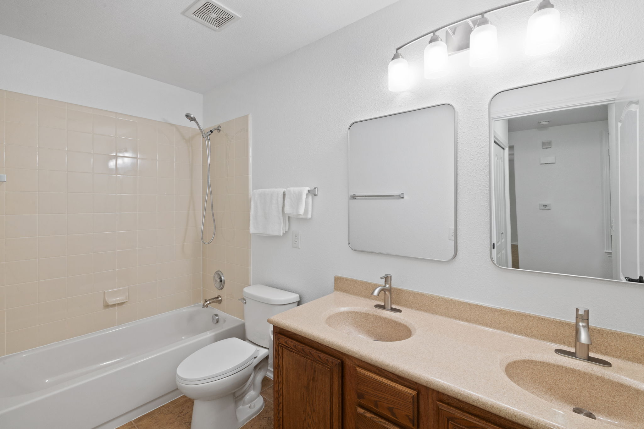 8825 Stambourne Street Austin, TX 78747 - Photo 19 of 37 a bathroom with a sink toilet tub and shower