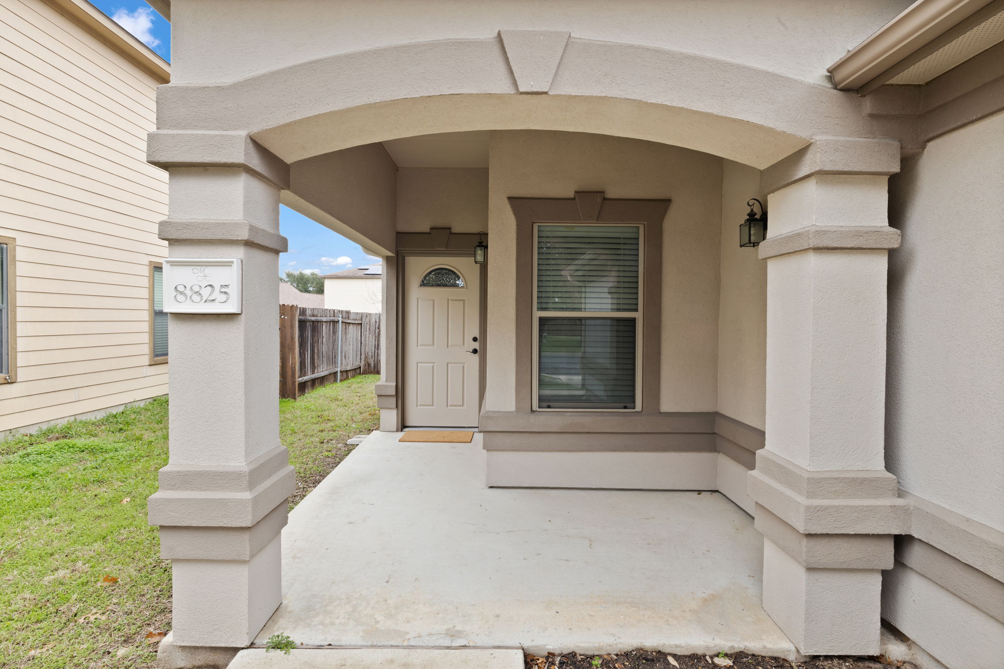 8825 Stambourne Street Austin, TX 78747 - Photo 2 of 37 a front view of a house with a porch