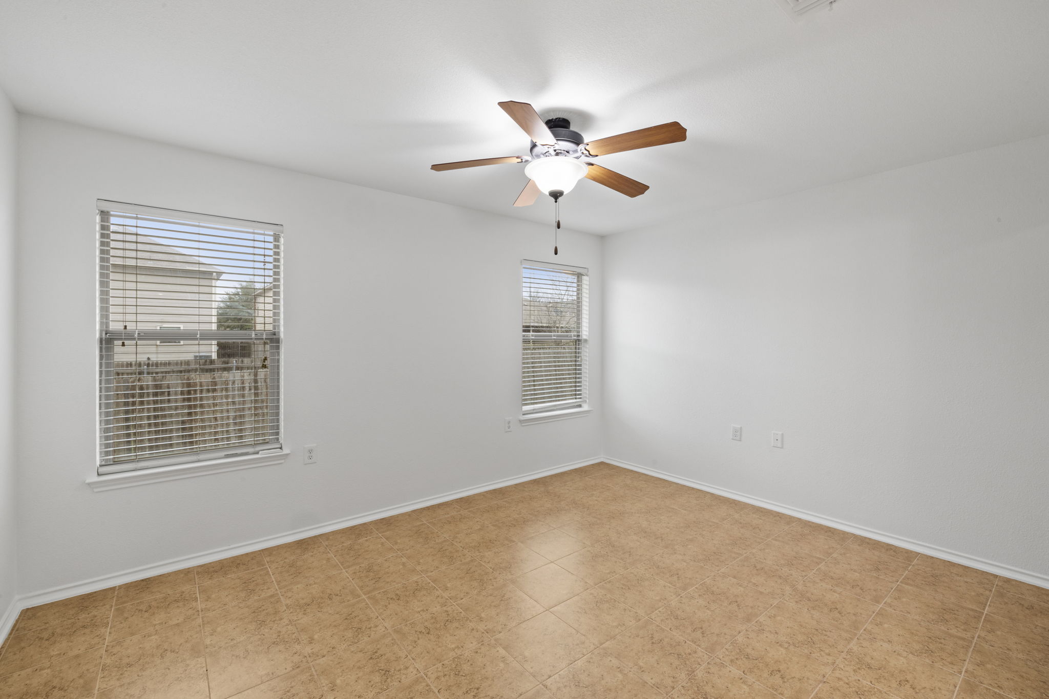 8825 Stambourne Street Austin, TX 78747 - Photo 21 of 37 a view of an empty room with a window