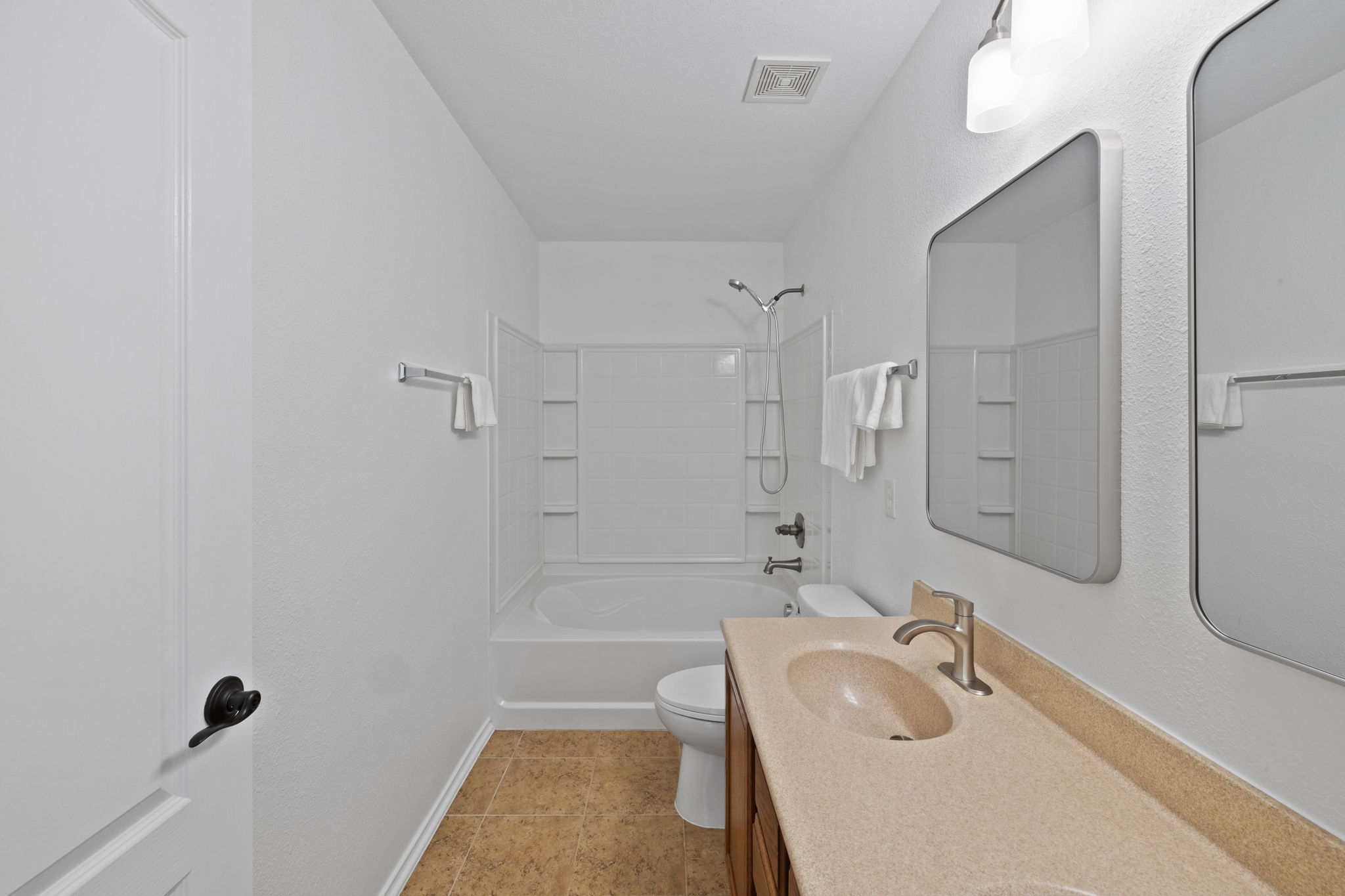 8825 Stambourne Street Austin, TX 78747 - Photo 24 of 37 a bathroom with a tub sink toilet and shower