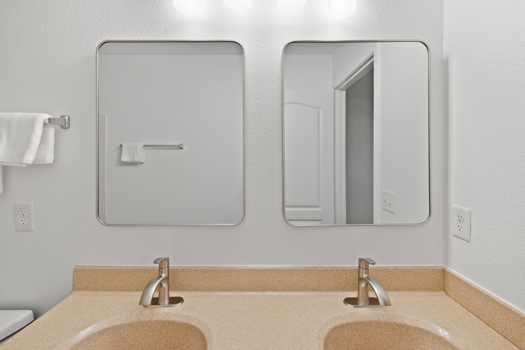 8825 Stambourne Street Austin, TX 78747 - Photo 25 of 37 a bathroom with double vanity sink and mirror