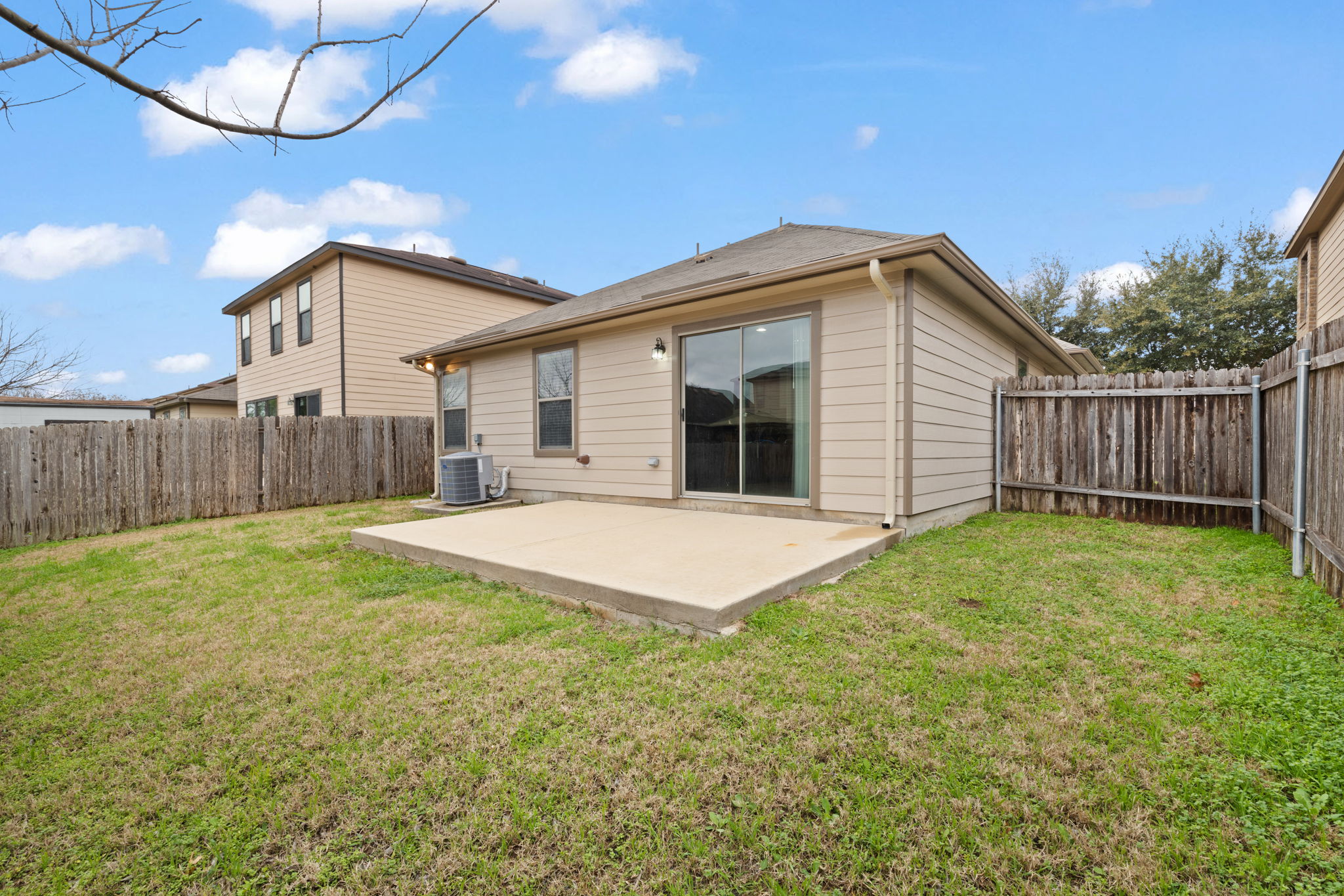8825 Stambourne Street Austin, TX 78747 - Photo 30 of 37 Back of house with a patio and a fenced backyard