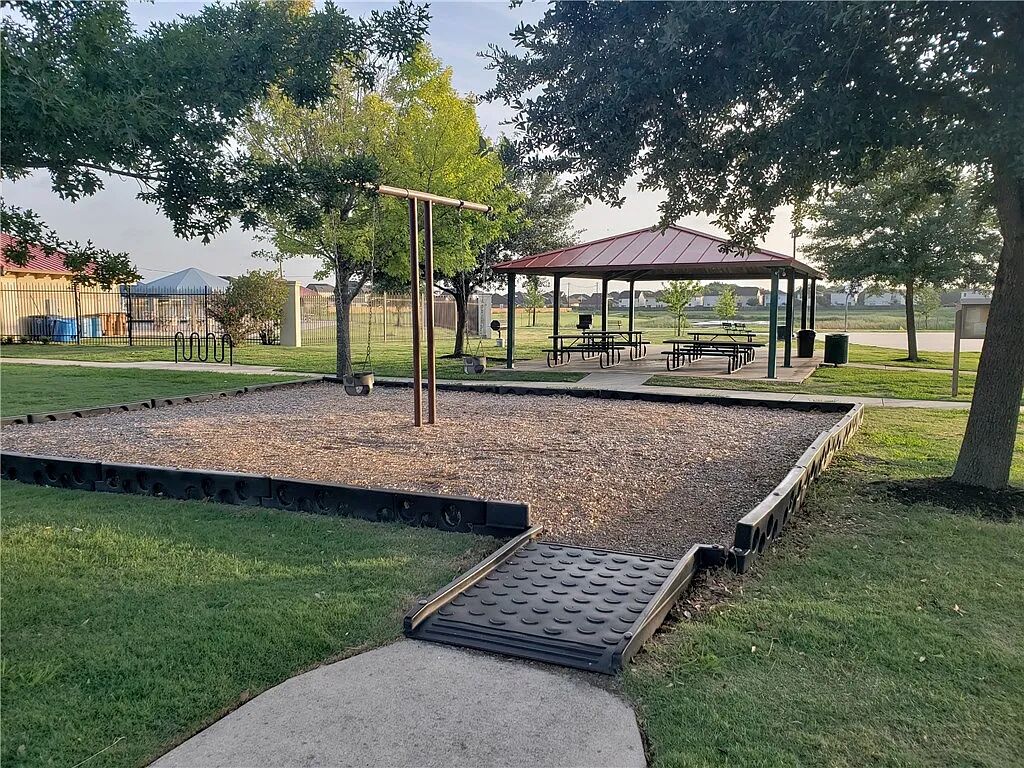 8825 Stambourne Street Austin, TX 78747 - Photo 35 of 37 View of community featuring a patio area and a gazebo