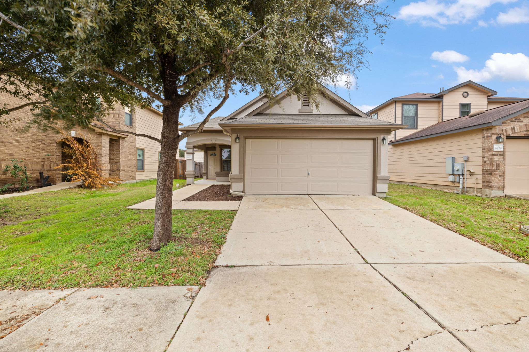 8825 Stambourne Street Austin, TX 78747 - Photo 36 of 37 a front view of house with yard