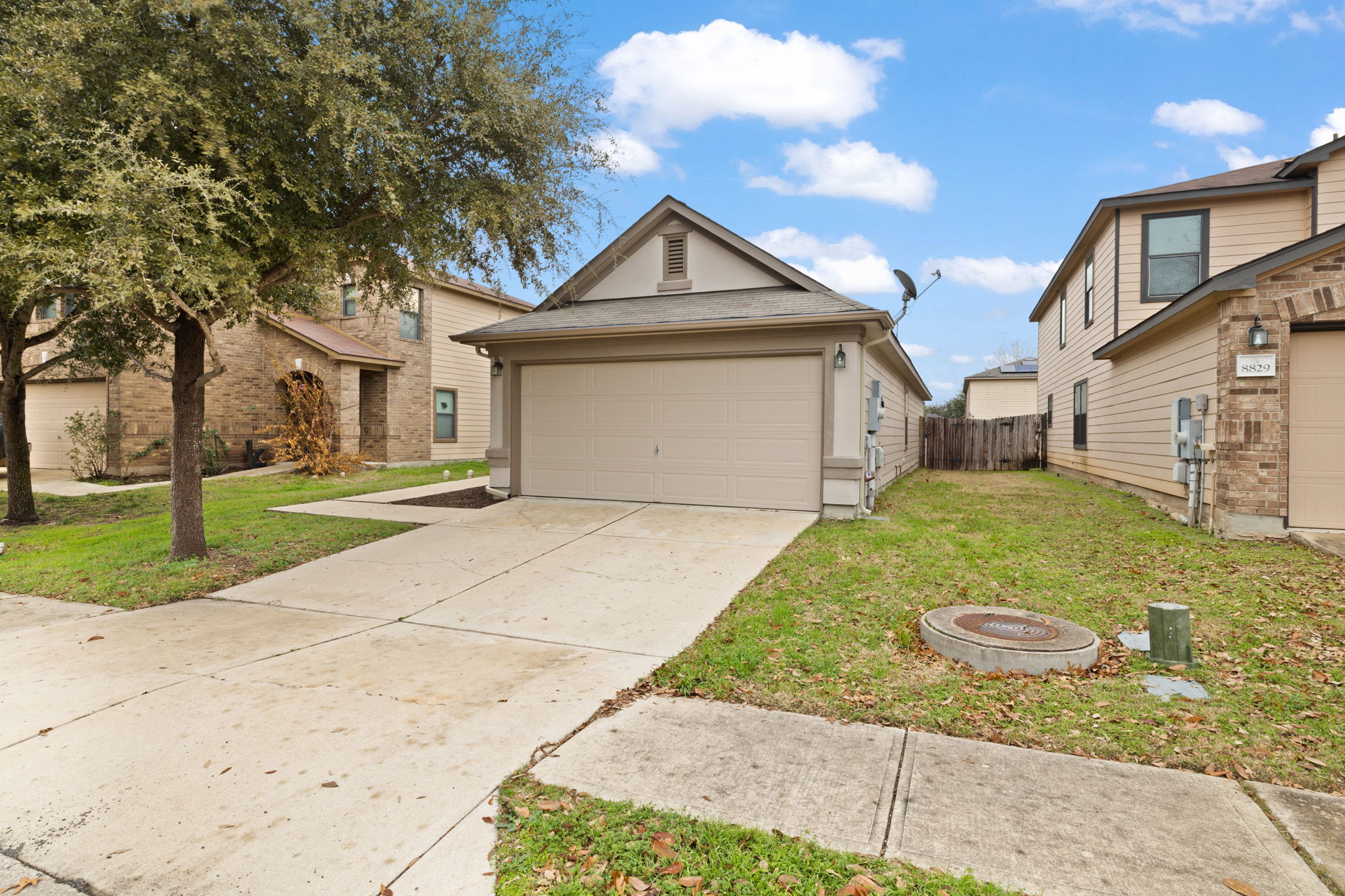 8825 Stambourne Street Austin, TX 78747 - Photo 37 of 37 a view of a house with a yard