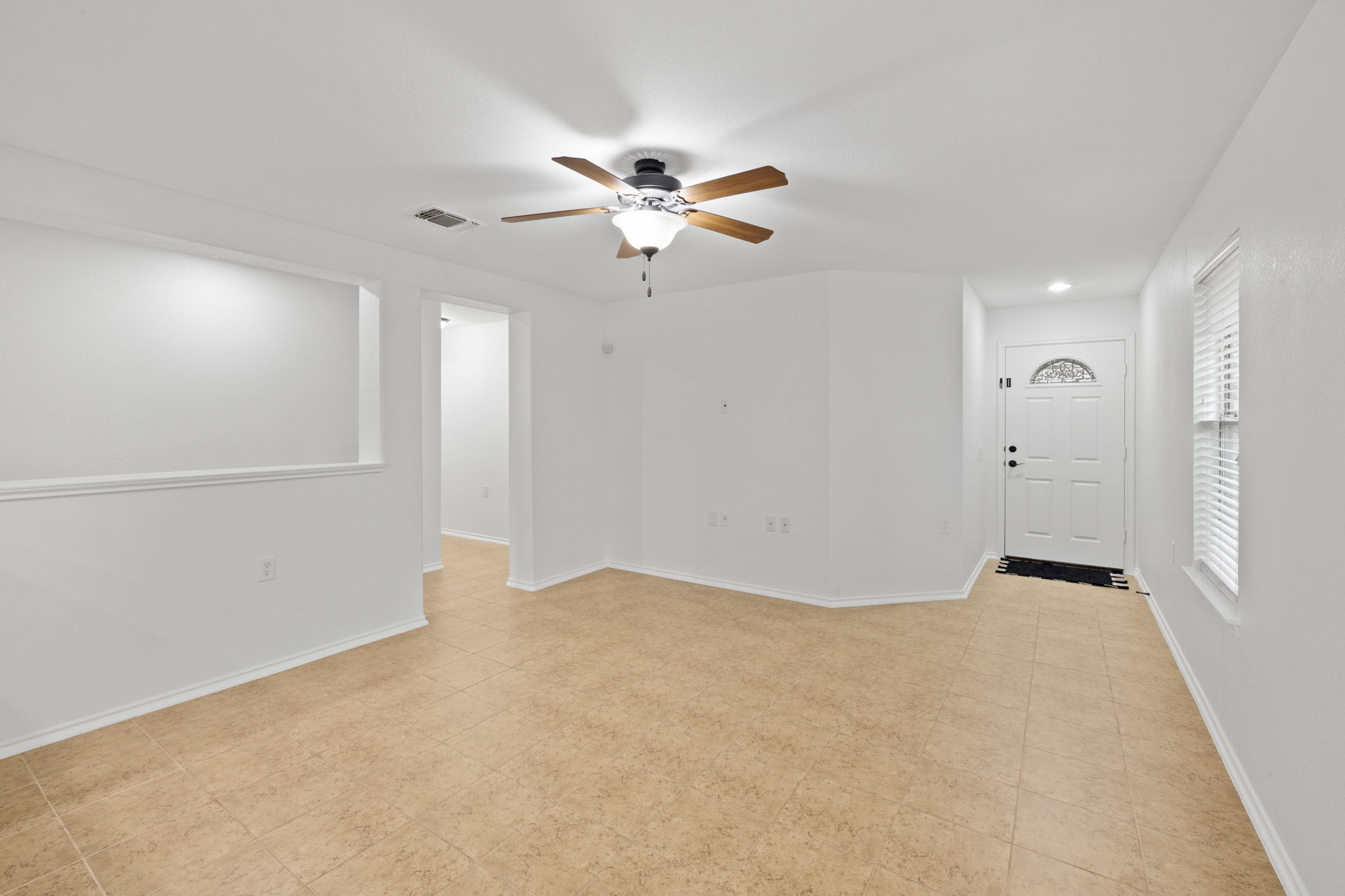 8825 Stambourne Street Austin, TX 78747 - Photo 6 of 37 an empty room with closet and a ceiling fan