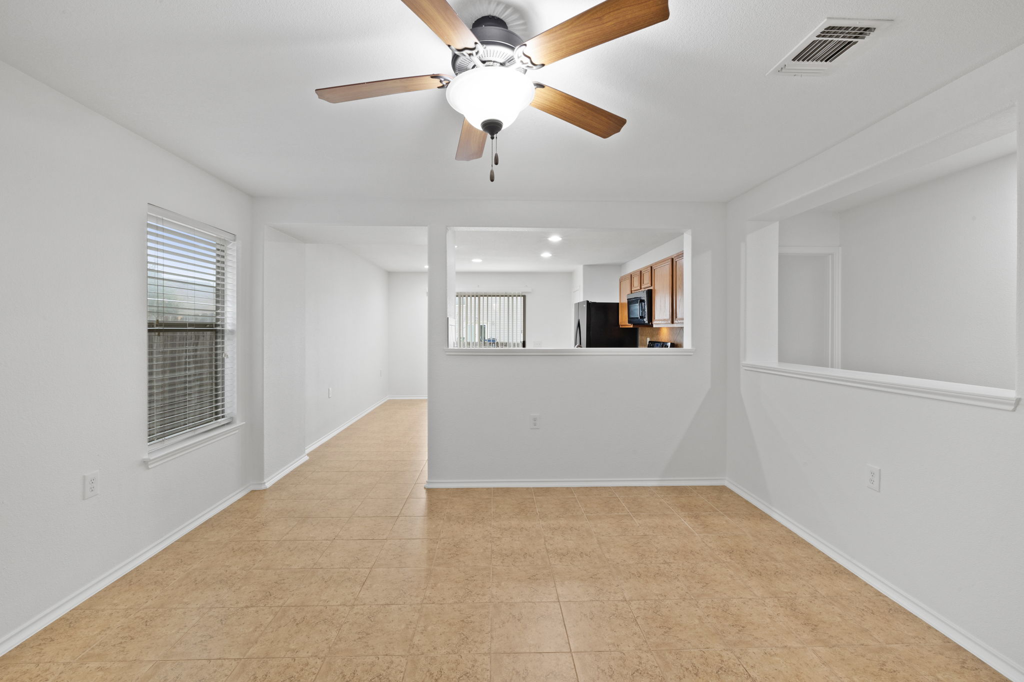 8825 Stambourne Street Austin, TX 78747 - Photo 8 of 37 Unfurnished room with a ceiling fan and recessed lighting