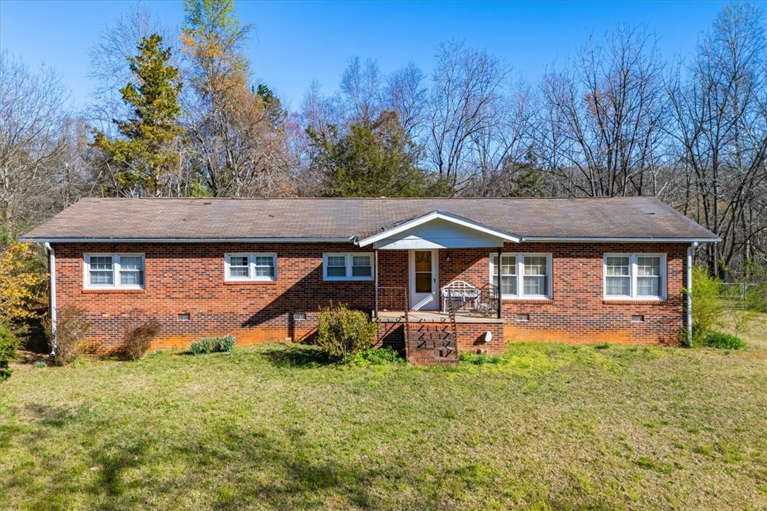 453 Deaton Road Walhalla, SC 29691 - Photo 11 of 28 This classic brick residence offers comfort and timeless appeal, nestled amidst natural surroundings.