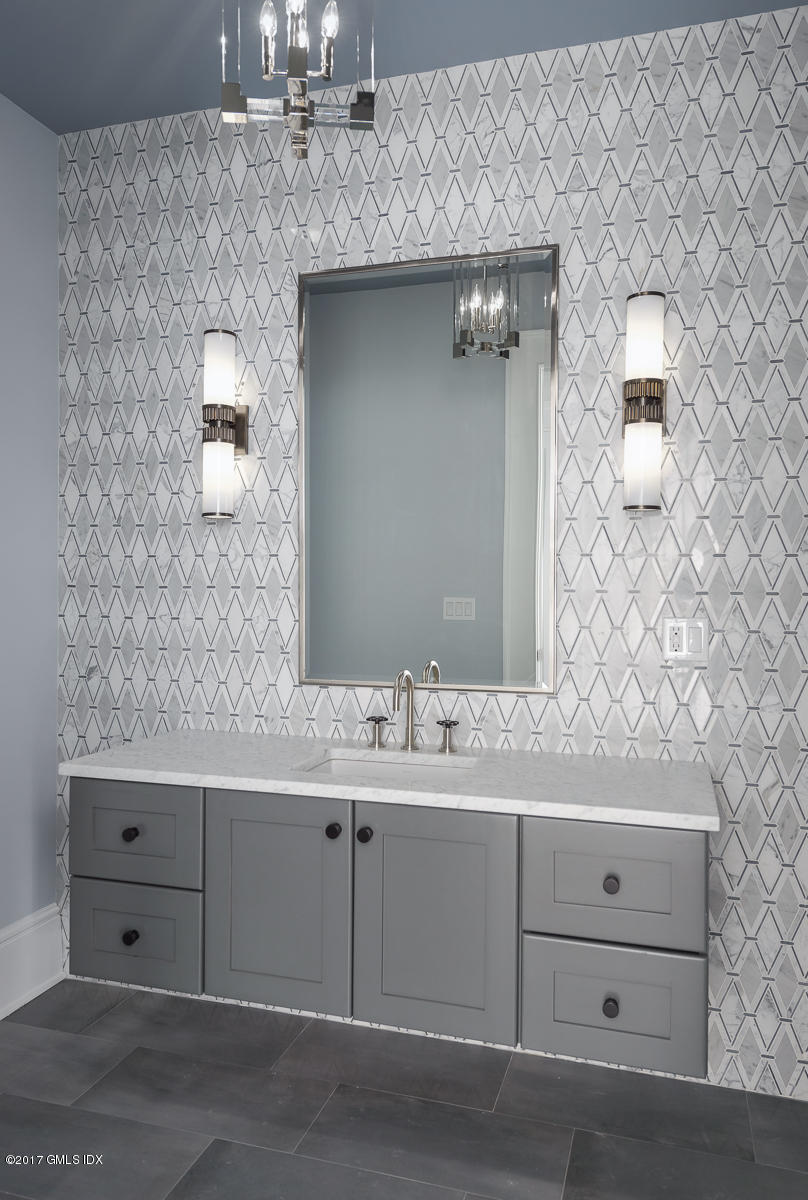 649 River Road Cos Cob, CT 06807 - Photo 15 of 27 a bathroom with a sink and a mirror