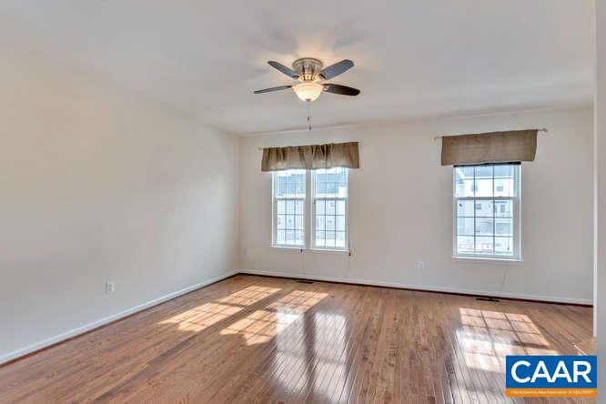 415 Rolkin Road Charlottesville, VA 22911 - Photo 6 of 21 a view of an empty room with a window and wooden floor