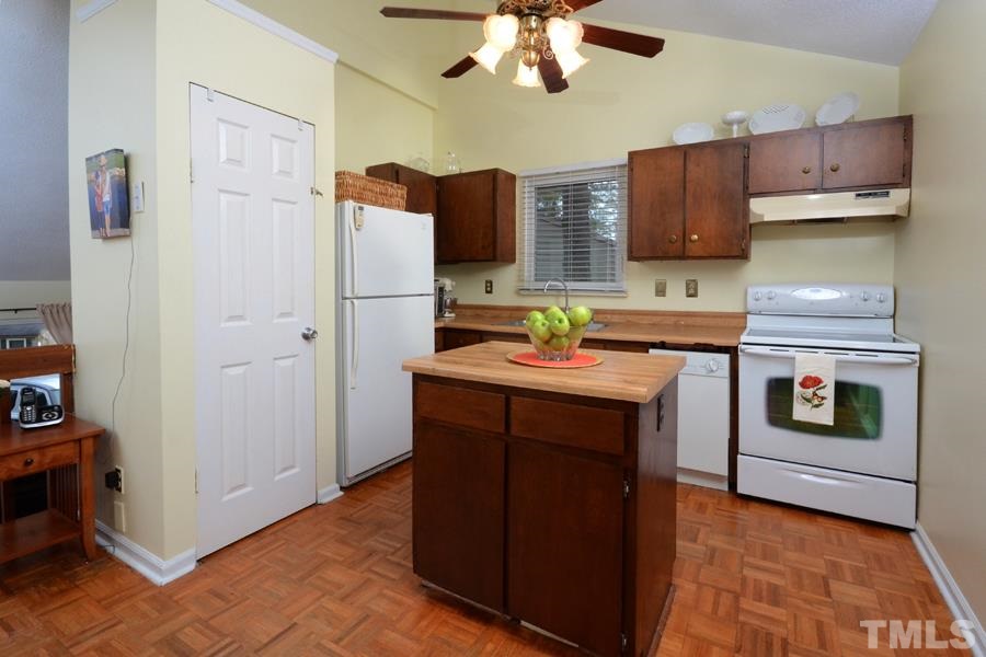 2401 Boothbay Court Raleigh, NC 27613 - Photo 8 of 21 with island. Refrigerator, range and dishwasher convey