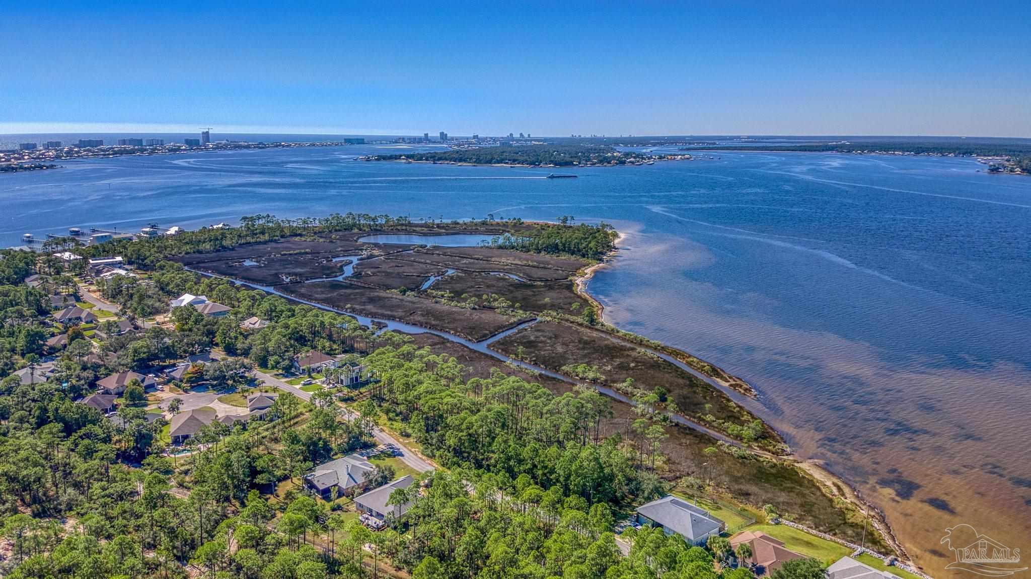 5426 North Shore Road Pensacola, FL 32507 - Photo 40 of 53 a view of a lake with a yard