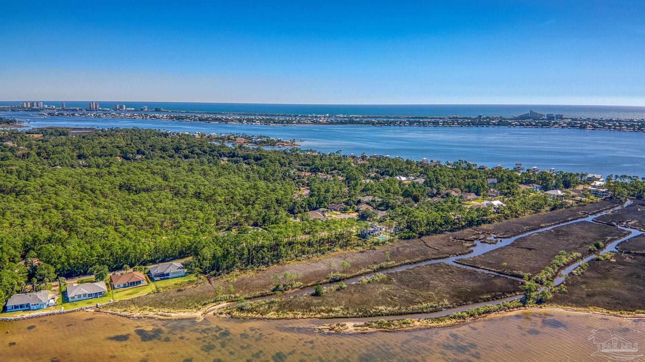 5426 North Shore Road Pensacola, FL 32507 - Photo 45 of 53 an aerial view of a house with a yard and lake view
