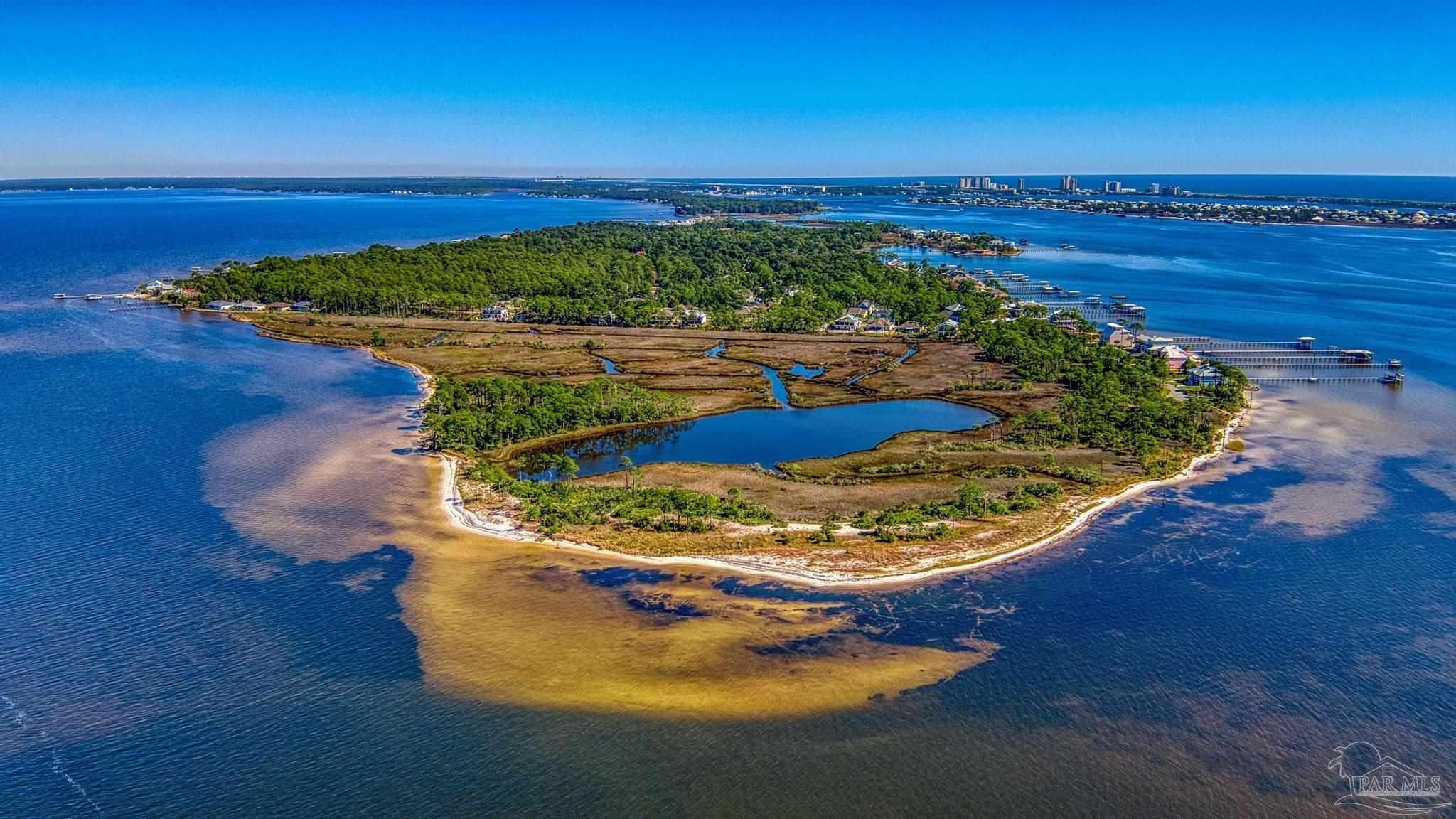 5426 North Shore Road Pensacola, FL 32507 - Photo 47 of 53 a view of a swimming pool with an ocean beach