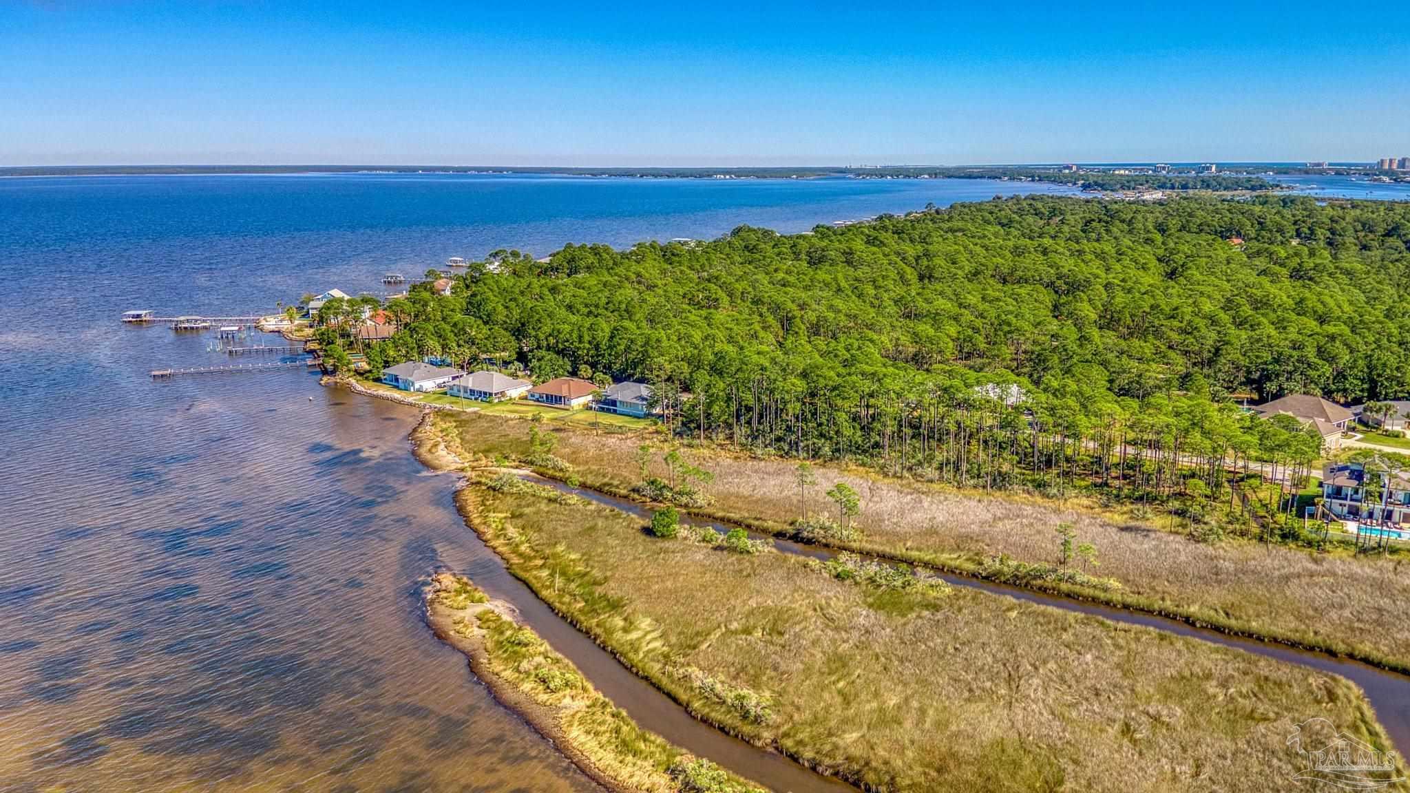 5426 North Shore Road Pensacola, FL 32507 - Photo 6 of 53 a view of a lake and a mountain view