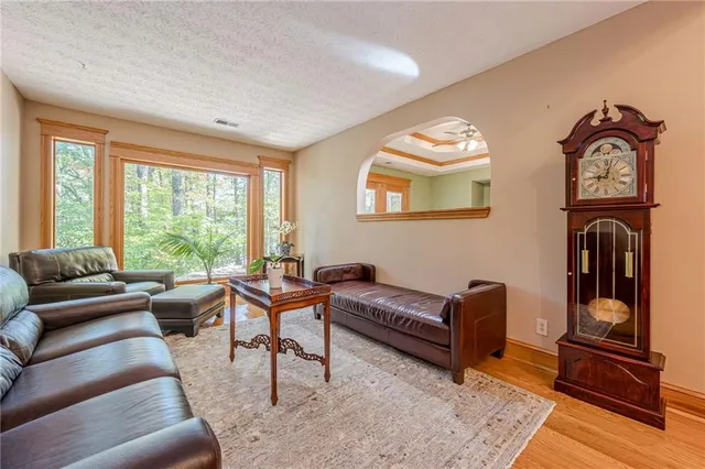 a view of a dining room with furniture window and wooden floor