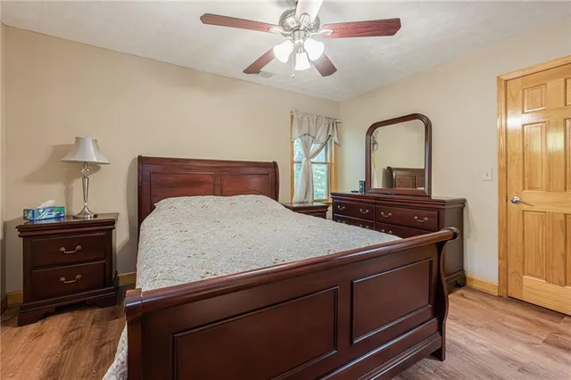 a white toilet sitting next to a bath tub