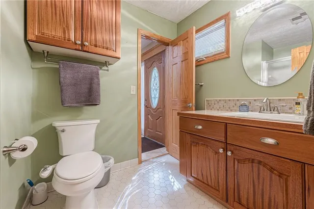 a kitchen with stainless steel appliances granite countertop a refrigerator sink and cabinets