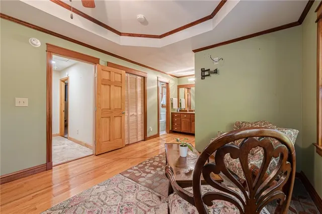 a view of a dining room with furniture and a window
