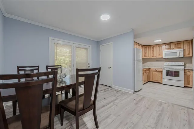 a kitchen with stainless steel appliances granite countertop a stove and a refrigerator