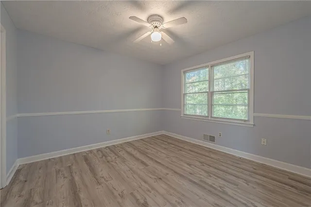 a kitchen with stainless steel appliances a refrigerator and a stove