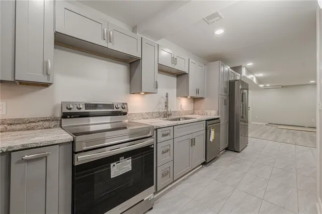 a view of a swimming pool with lawn chairs and plants