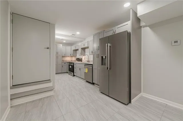 a view of a lake with houses in the background