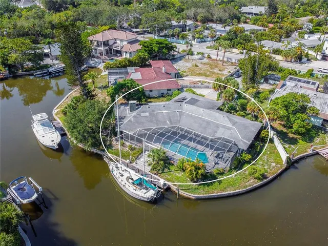 an aerial view of a house with a ocean view
