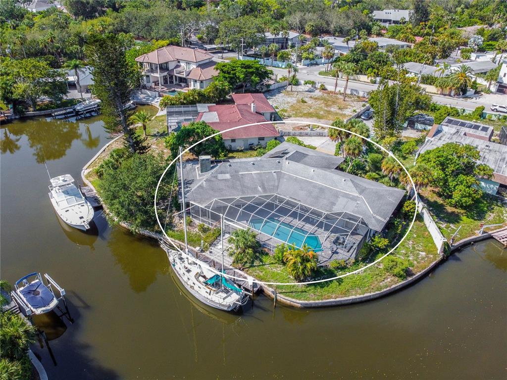 an aerial view of a house with a ocean view