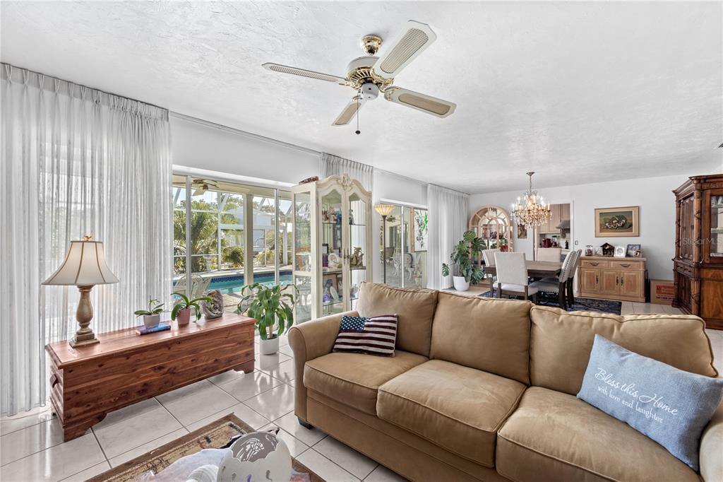 6937 Midnight Pass Road Sarasota, FL 34242 - Photo 13 of 30 a living room with furniture and a large window