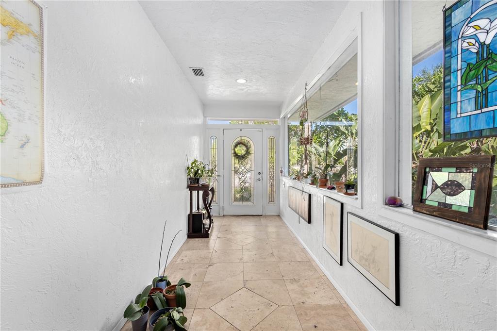 6937 Midnight Pass Road Sarasota, FL 34242 - Photo 15 of 30 a hallway with sliding door and stairs