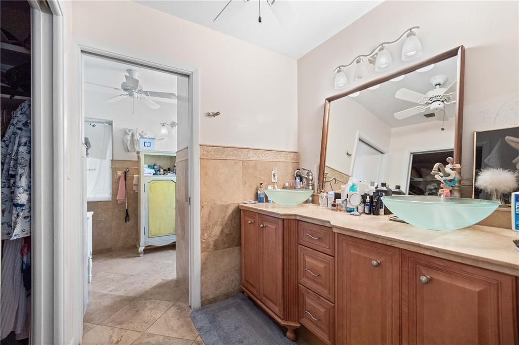 6937 Midnight Pass Road Sarasota, FL 34242 - Photo 19 of 30 a kitchen with a sink and refrigerator