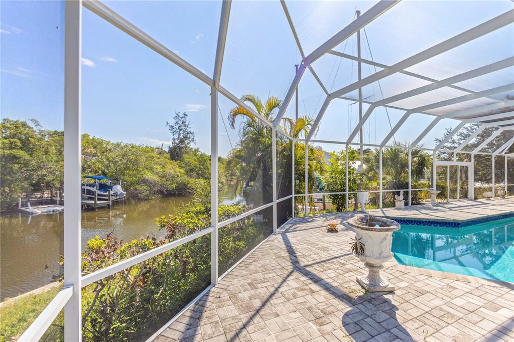 6937 Midnight Pass Road Sarasota, FL 34242 - Photo 22 of 30 a view of a swimming pool with outdoor seating