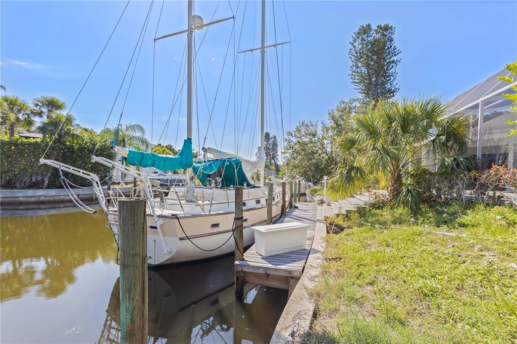 6937 Midnight Pass Road Sarasota, FL 34242 - Photo 23 of 30 a view of a swimming pool and lounge chairs