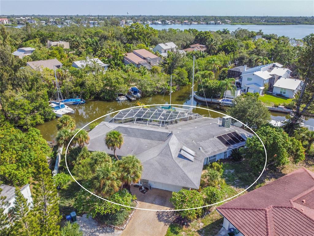 6937 Midnight Pass Road Sarasota, FL 34242 - Photo 24 of 30 an aerial view of a house with a garden