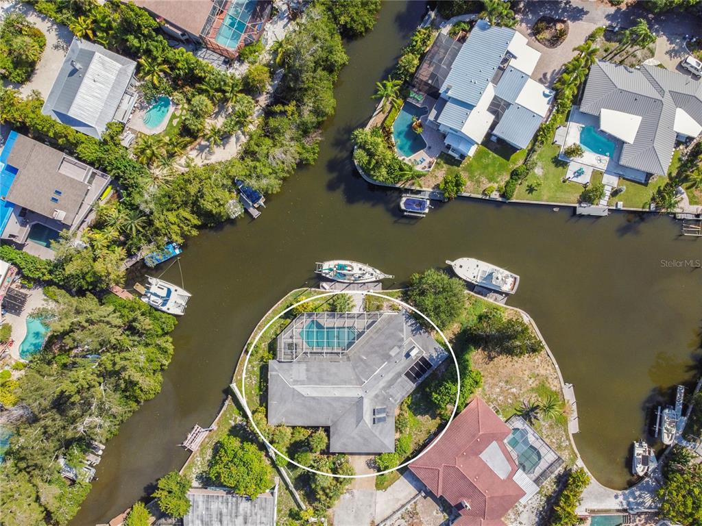 6937 Midnight Pass Road Sarasota, FL 34242 - Photo 28 of 30 an aerial view of a house with a lake view