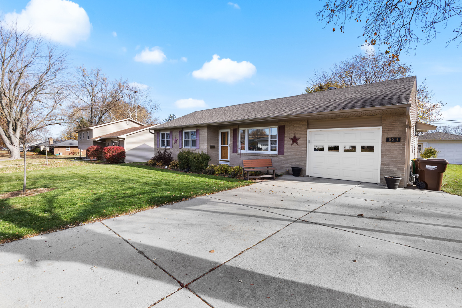 539 Riley Drive Marengo, IL 60152 - Photo 2 of 17 a front view of a house with a yard and garage