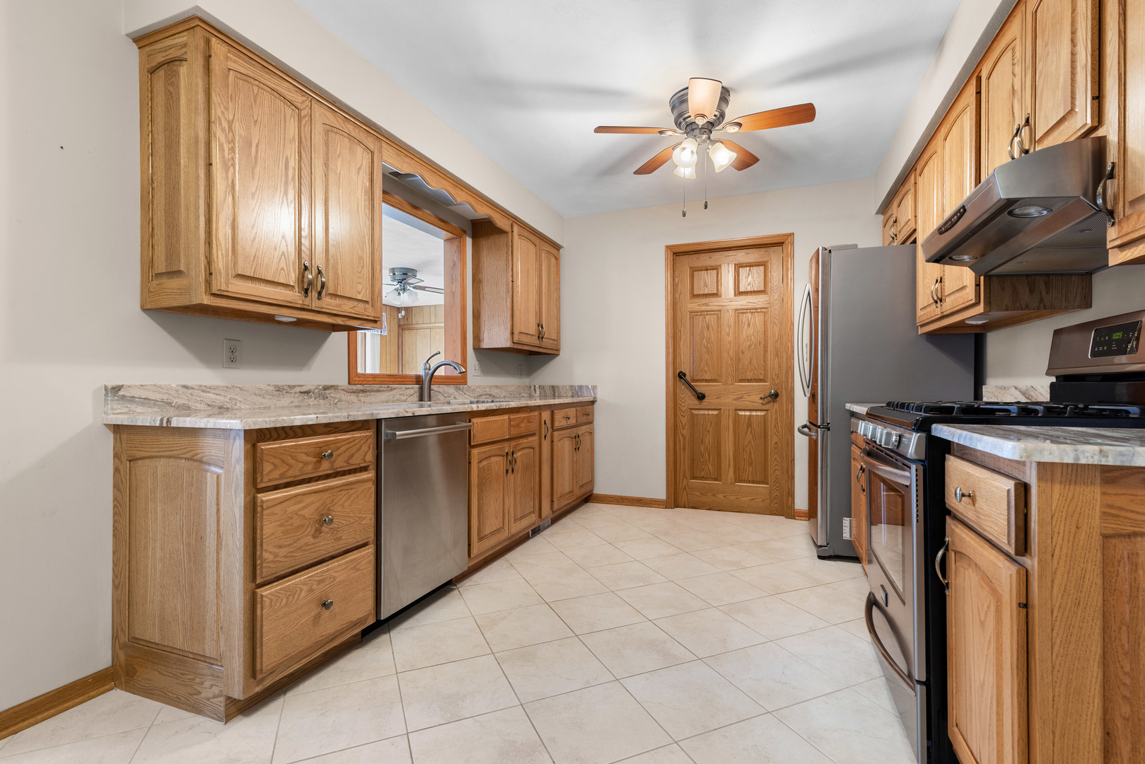539 Riley Drive Marengo, IL 60152 - Photo 5 of 17 a kitchen with stainless steel appliances granite countertop a stove cabinets and a refrigerator
